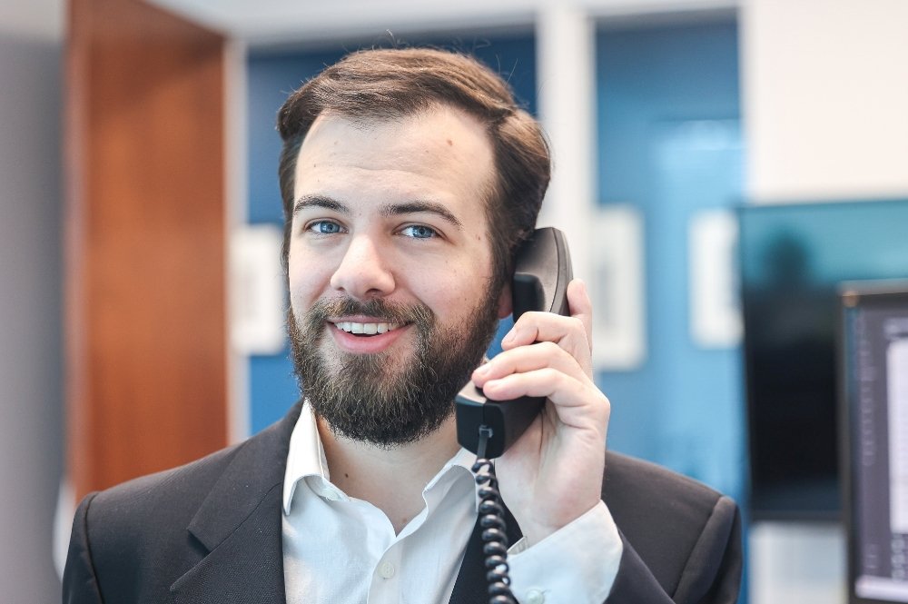 Clinical research coordinator on phone streamlining clinical trial screening process to reduce site burden
