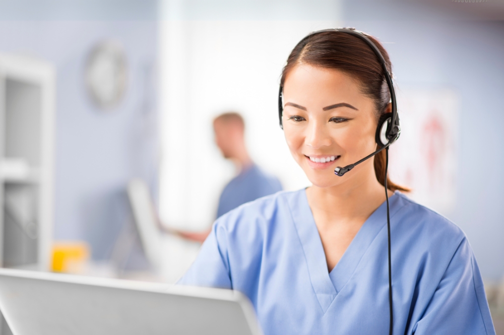 Nurse at a Patient Support Call Center Calling a potential patient giving telephonic nurse support