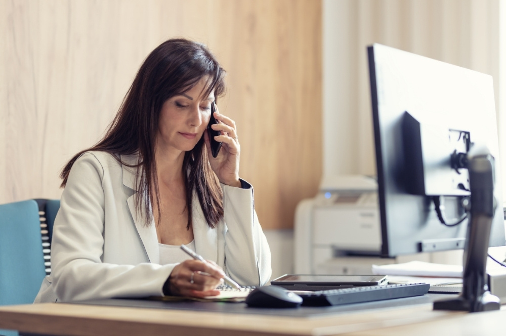 Reimbursement specialist on the phone coordinating patient access support
