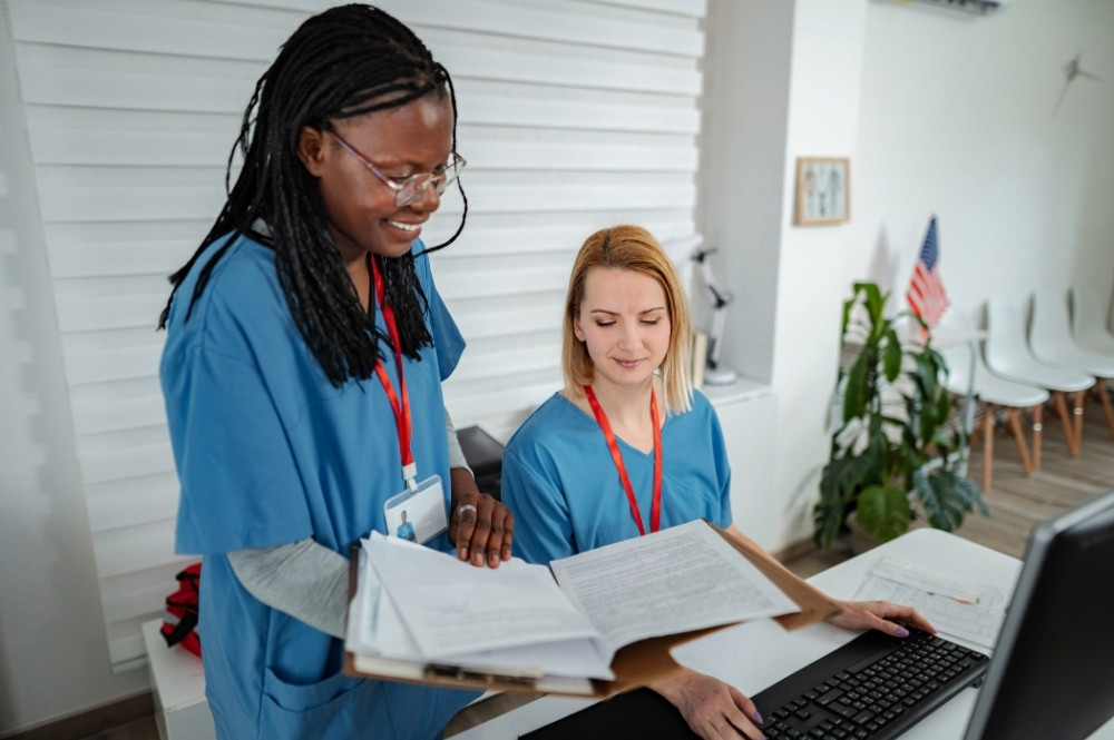 Healthcare professionals reviewing paperwork to reduce provider administrative burden